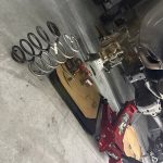 Mobile mechanic performing suspension repair and coil spring replacement on a Jeep Wrangler in Sheboygan County, Wisconsin.